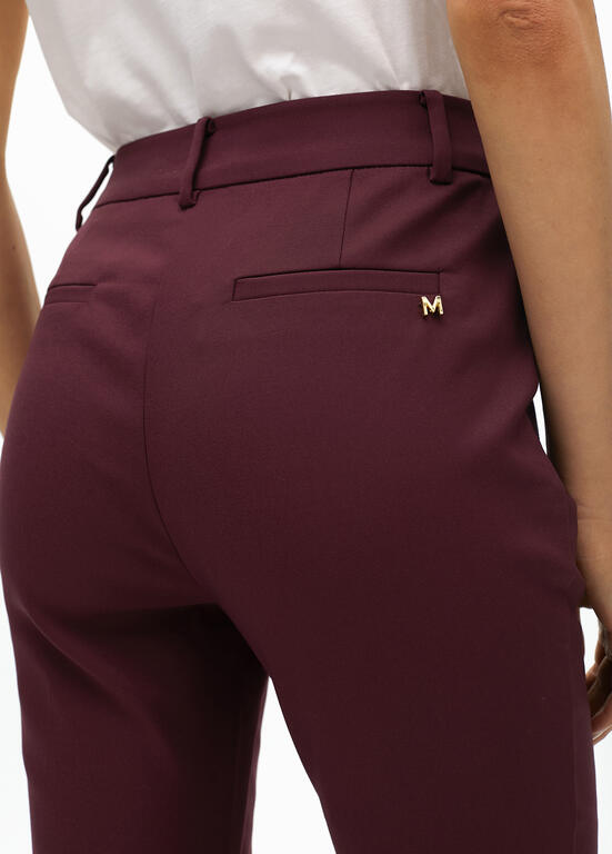 Stretch fabric trousers with zipped pocket